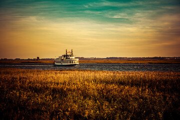 Fototapeta premium sunset over a steam boat