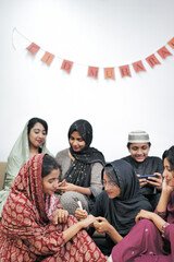 Happy Muslim family celebrating Eid Mubarak