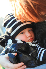 mother hugs upset child on the street
