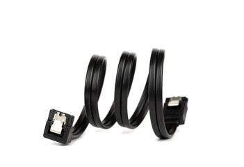 Soft focus on a black cable with a SATA connectors on a white background.