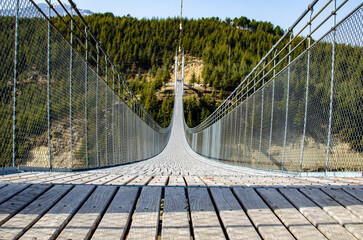 Obraz premium suspension bridge over the river
