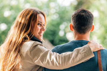 Fototapeta premium couple hugging on the street outdoors in autumn