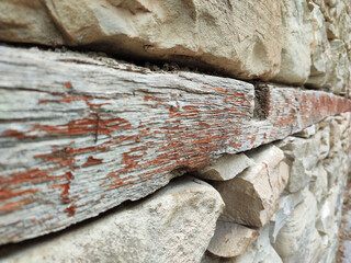 wood in stone wall for compression