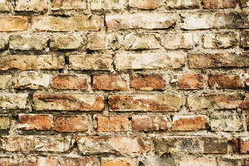 Brick wall background. Urban rustic texture. Antique house exterior wall. Vintage abandoned building architecture. Red brick construction. Grunge background.