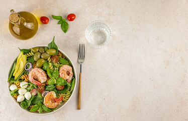 Pasta or noodle salad from wheat and lentils fusilli with avocado and shrimp. Lunch or dinner meals contain carbohydrates, protein, and dietary fiber. also, gut for the keto diet.