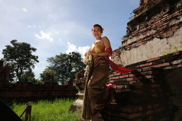 Asia Loy krathong tradition that paid respects to the water spirits, Beautiful woman dressed in...