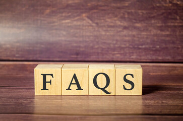 FAQ Wooden blocks text and wooden background