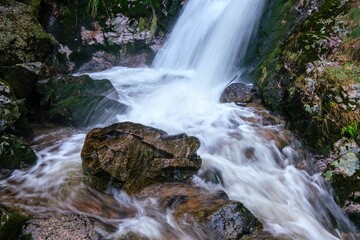 Beautiful shot of All Saints Waterfall flowing on rocks
