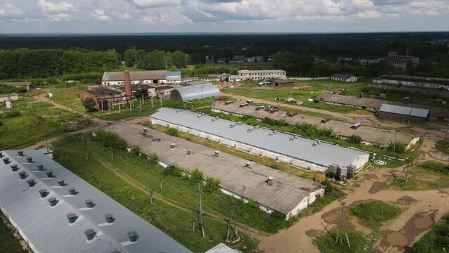 Aerial of Agricultural barns of chicken farm located in vast rural valley