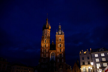 Fototapeta na wymiar Saint Marys Cathedral lit up at night in Krakow, Poland