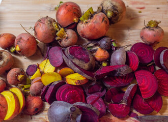 Golden and Red beets on a wooden plank