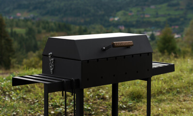 Closed barbeque grilled with mountain view