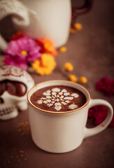 Champurrado. Chocolate. Traditional Mexican Chocolat. Cup of hot chocolate. Bebida tradicional mexicana Champurrado. Day of the dead celebration and lots of marigolds