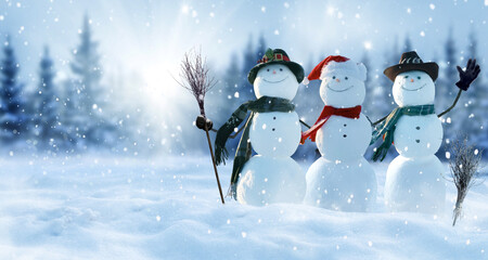 Merry Christmas and happy New Year greeting card with copy-space.Many snowmen standing in winter...