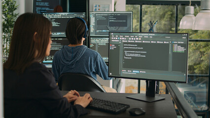 Woman programer typing source code on computer keyboard to develop new app server, cloud computing....