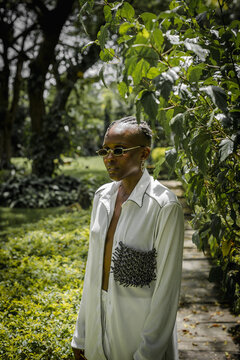 medium portrait of a woman dressed fashionable in a garden