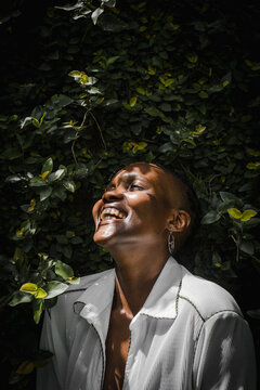Closeup of black woman smiling in garden 