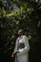 portrait of black woman basking in sunlight 