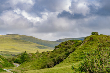 Fototapeta na wymiar The Fairy Glen,with cone shaped hills and winding paths,summertime,Trotternish,Isle of Skye,Scotland.