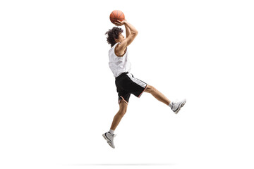 Athlete jumping and shooting a basketball