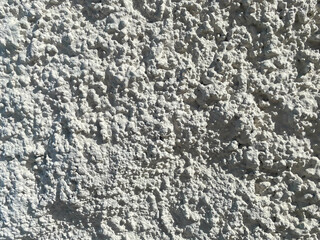 The texture is the background of a white decorative facade volumetric shurpaty plaster bark beetle. The background