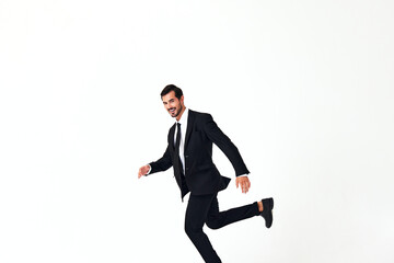 Fototapeta na wymiar Man business smile with teeth in costume running and jumping up open mouth happiness and surprise full-length on white isolated background copy place 