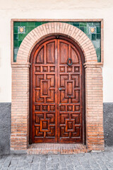 Old and beautiful ornate door in Granada, Spain