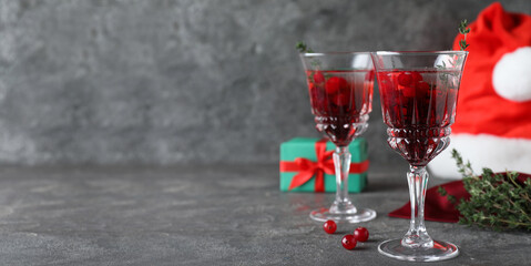 Delicious Christmas cocktail with liqueur on grey table, space for text. Banner design
