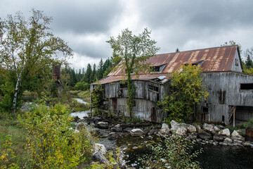 old abandoned wooden building in the woods