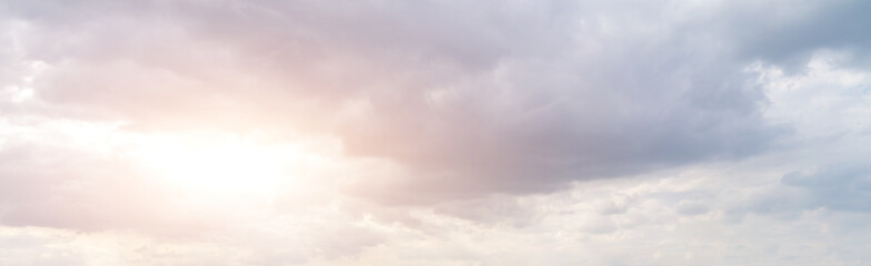 Naklejka na ściany i meble Panorama of golden cloudy sky with sun rays and heavenly back light
