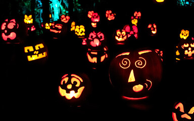 Carved Jack-o-lanterns lit at night for Halloween	