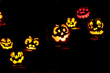 Carved Jack-o-lanterns lit at night for Halloween	