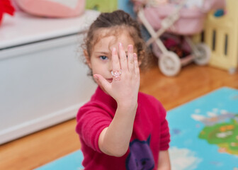 Cute girl playing with her fashion accessories