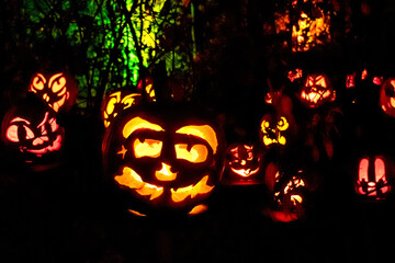 Carved Jack-o-lanterns lit at night for Halloween	