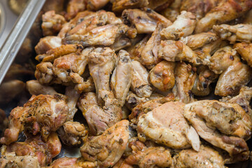 Chicken thighs on the stove in detail.