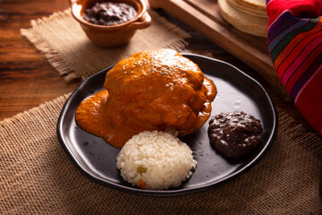 Encacahuatado. Mexican mole made from peanuts, dried chilies, sesame seeds, tomatoes and other...