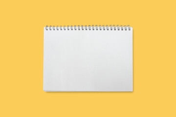 Notebook blank isolated on yellow background included clipping path.