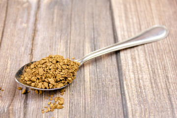 Instant coffee. Coffee powder product. Sublimated coffee.Instant coffee in a spoon.