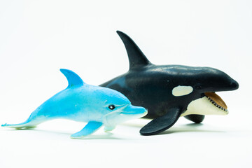 Dolphins and Orcs Toys on white background