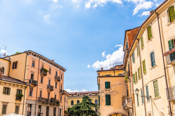 Fototapeta na wymiar Low angle view of houses. Streets of Verona, Veneto, Italy