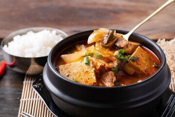 Korean food, Kimchi soup with tofu and pork in Korean stone pot