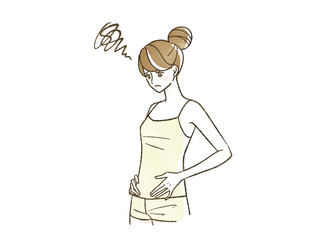 困った表情でお腹を触っている女性