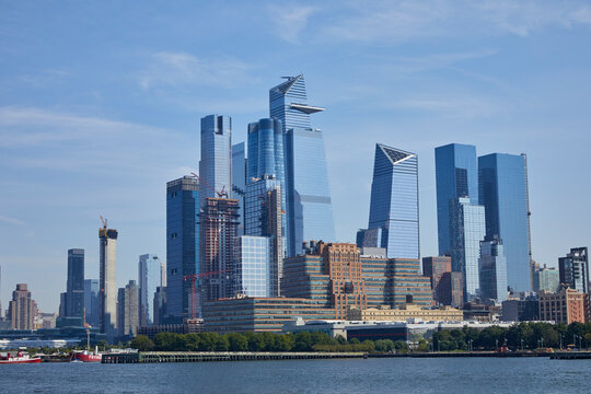 Modern skyscrapers of New York City on a sunny blue sky day viewed from the harbor
