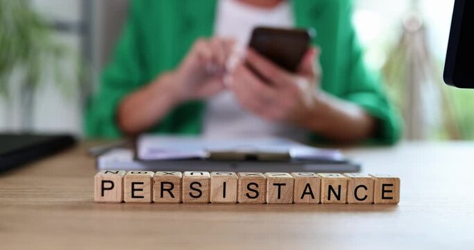 Business woman smartphone text on cubes insistent
