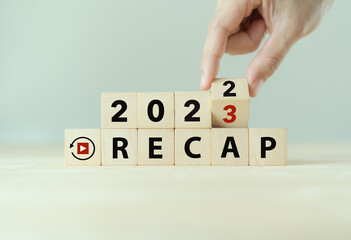 2022 Recap economy, business, financial concept. Business plan in 2023.  RECAP words, 2022 and 2023 on wooden cubes on smart grey background and copy space. - obrazy, fototapety, plakaty