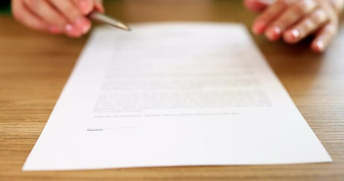 Agent hands over document to sign contract closeup