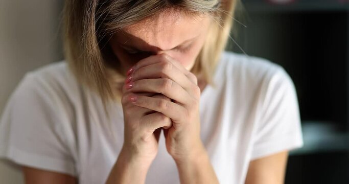 Unhappy young woman covering her face with hands feeling desperately betrayed