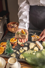 Beautiful natural handmade soap, packed in kraft paper and tied with a ribbon. Concept of an interesting hobby and useful eco friendly organic gifts