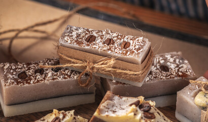 Beautiful natural coffee soap wrapped in kraft paper and tied with a ribbon. Concept of an interesting hobby and handmade gifts