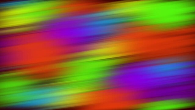 Twisted vibrant iridescent gradient blurred of green purple red orange yellow blue and pink colors with smooth movement of the gradient in the frame with copy space. Abstract sideways narrow lines